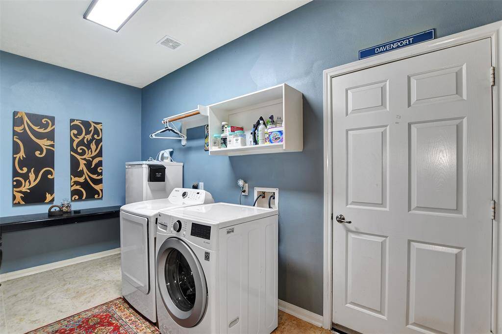 washer & dryer can stay in this large laundry room