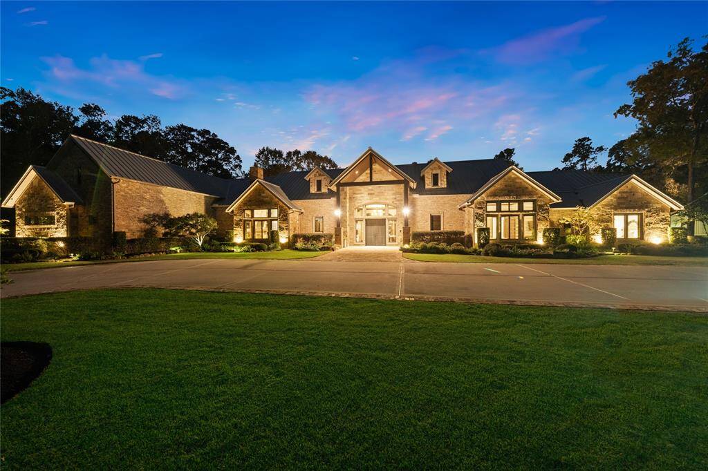 This spectacular 24 acre compound feels like you are in the middle of the Texas Hill Country, boasting privacy and serenity, but instead, you are just 15 miles from The Woodlands, consistently recognized as one of America's best cities, and just 35 miles from downtown Houston!