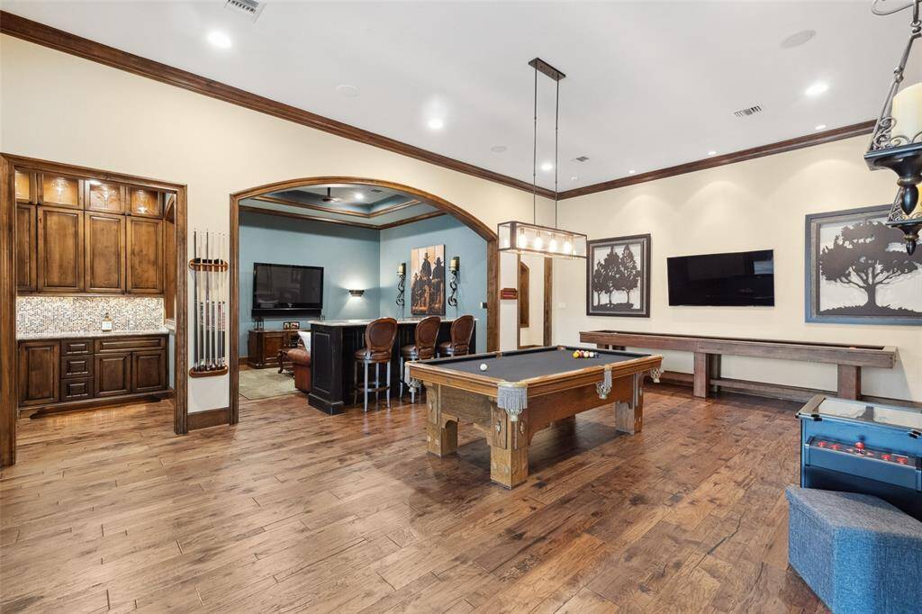 Currently used and loved as a gaming space--with billiards, shuffleboard and even vintage Ms. Pacman video games--the game room is spacious enough for whatever your needs.