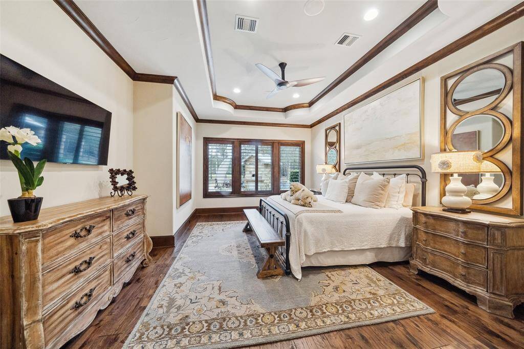 A tray ceiling adds architectural interest to this spacious secondary bedroom with en-suite bath. The home features a built-in Hide-A-Hose vacuum system with 30' hoses installed in the walls at each of 9 ports for convenient maintenance and cleaning.