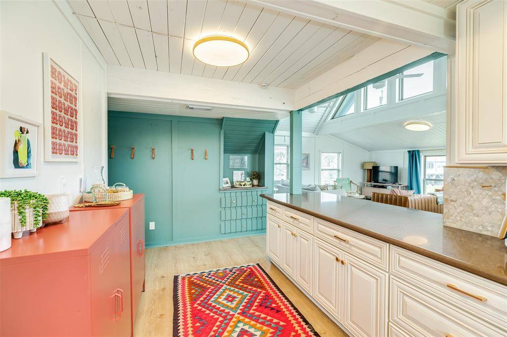 Luxurious quartz countertops enhance the kitchen's elegance and durability.
