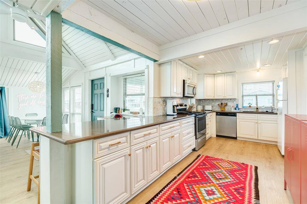 Bright and inviting open-concept kitchen leading seamlessly into the living area, perfect for entertaining and family gatherings.
