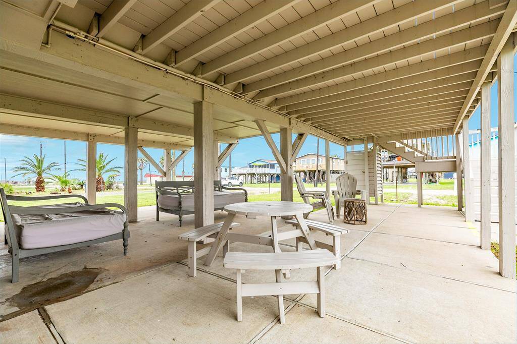 Spacious outdoor entertainment area with ample seating, perfect for gatherings and relaxation.