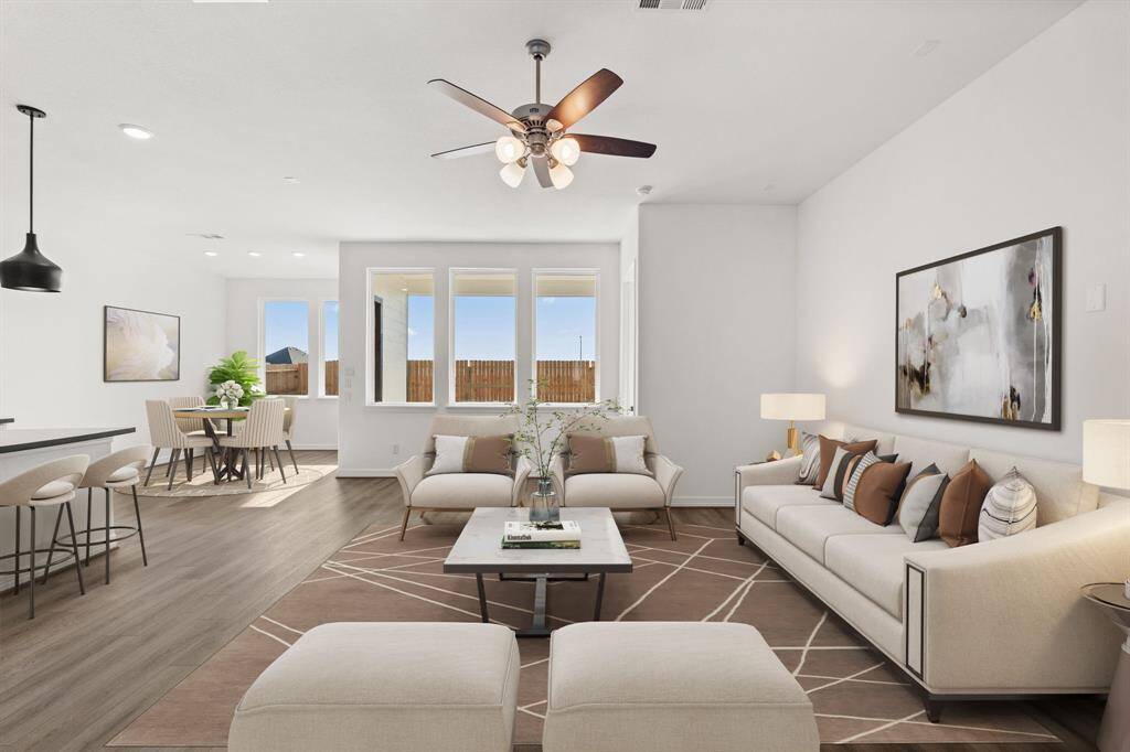 This home boasts a spacious open concept layout that combines the best of modern design and comfort for everyday living. Photo is virtually staged