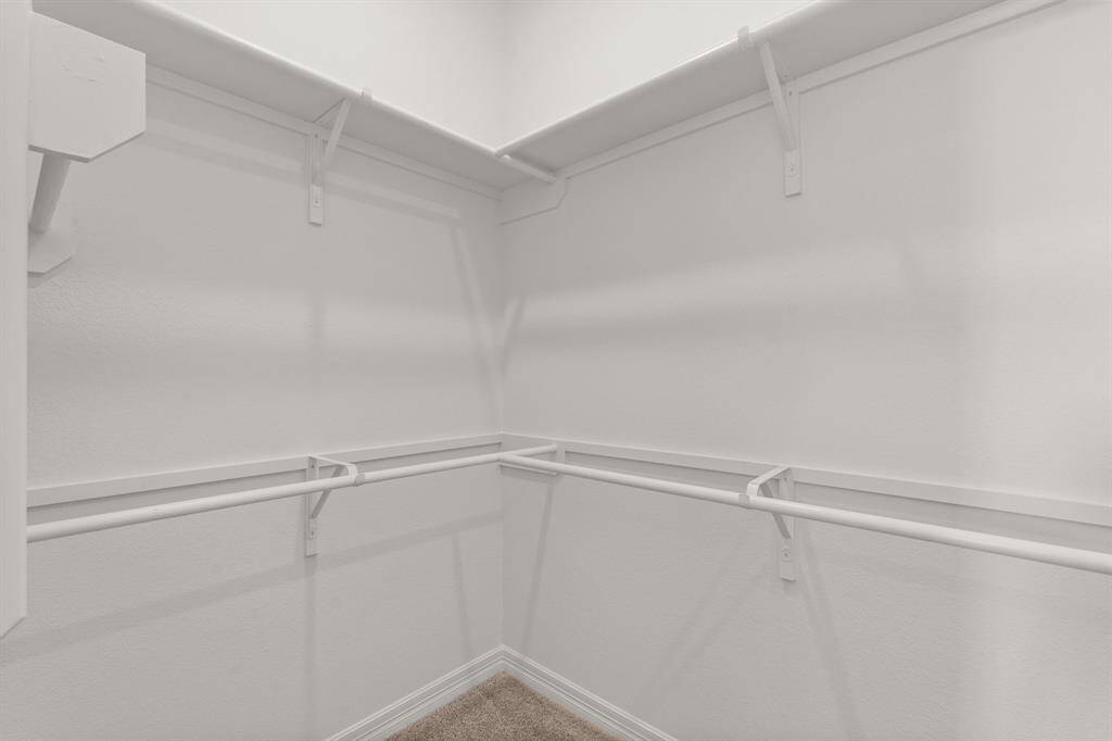 A view of your large primary walk-in Closet