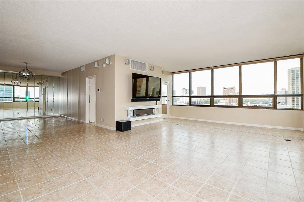 Living room with glimpse of dining at end of photo