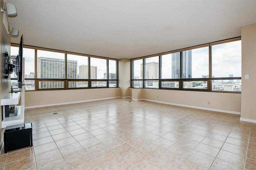 Living room has remote controlled blinds as do all of the other rooms. Tile flooring