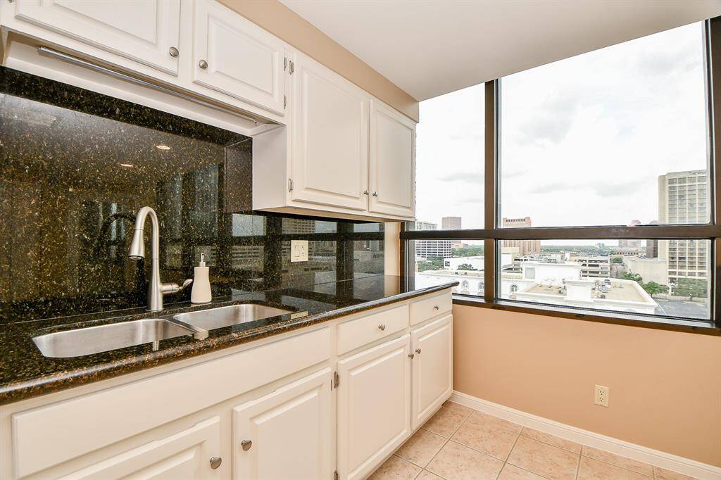 Stainless steel sinks. Granite counter tops and backsplash. Cabinets painted Sept '24