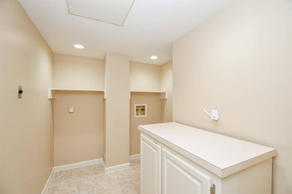 Oversized utility room with folding table & storage