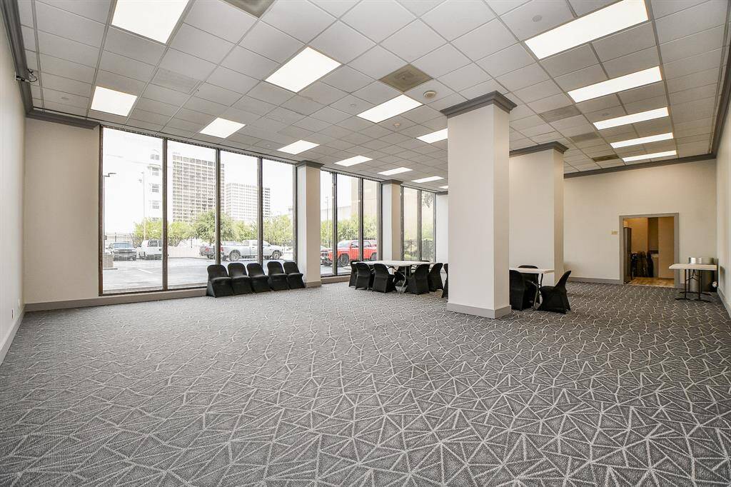 Huge party room/community meeting room with entrance to catering kitchen at rear of photo