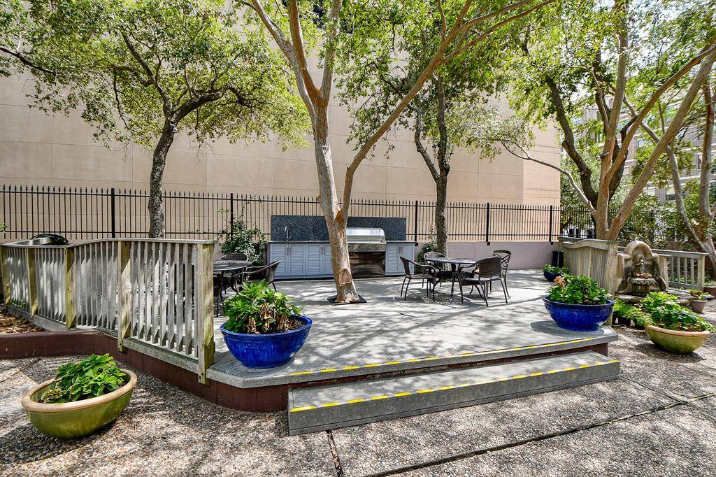 Outdoor kitchen/bbq area with tables and chairs