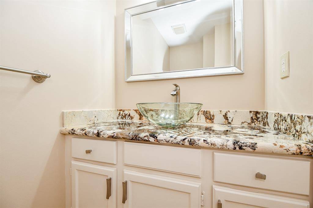 Half bath off entry with granite counter top