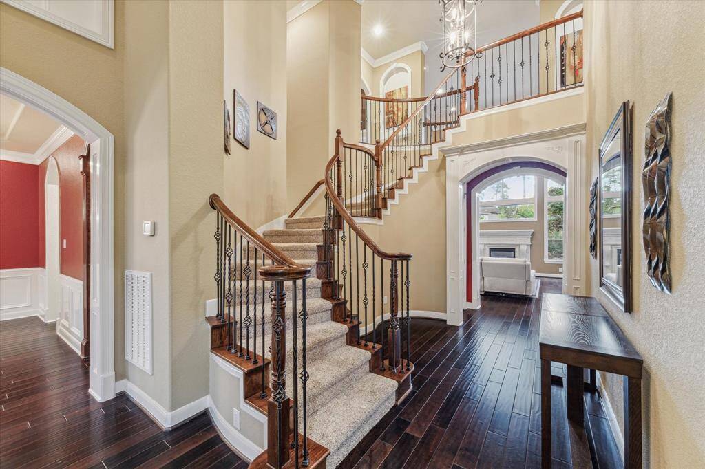 Grand entry way with wrought-iron balusters