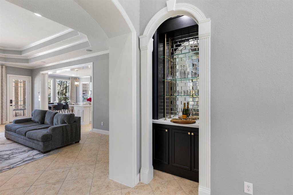 Notice the recently remodeled, striking bar nook, designed to be both functional and stylish, making it the perfect spot for storing your favorite beverages.