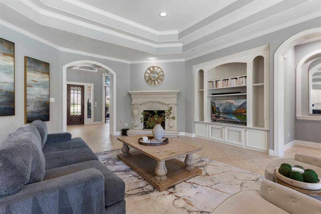 The living room boasts ample space, offering endless possibilities for various furniture arrangements. With its generous layout, it easily accommodates a range of seating options.