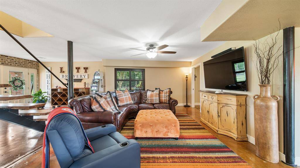 1st Floor Living Room has numerous options for Large Furniture Placements. Comfortable Living Area is next to the 1st Floor Bedroom Suite for a Guest's own relaxing TV time.