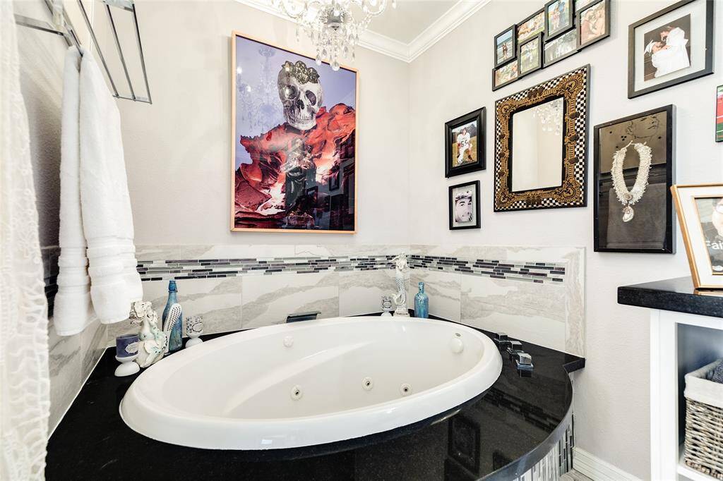 Relax under the chandelier in your jetted soaking tub