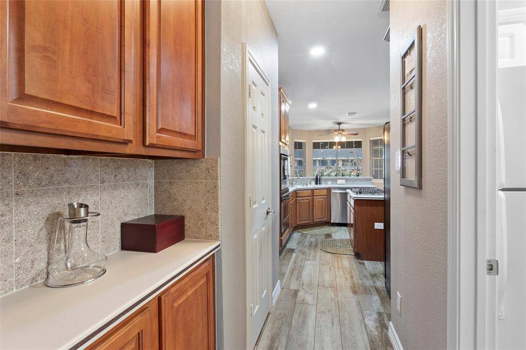 Butlers pantry between kitchen and dining room.