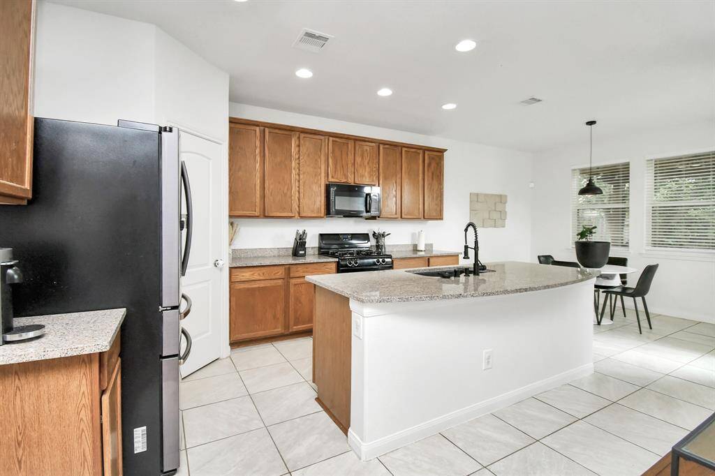 Kitchen is open to living room, perfect for entertaining