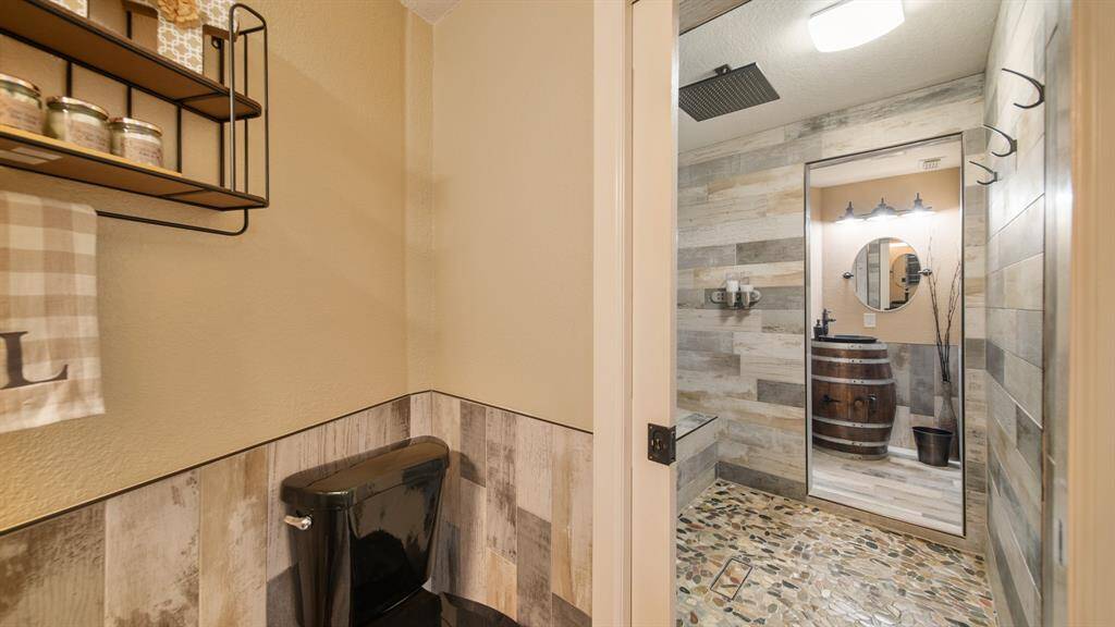 1st Floor Full Bath with Walk-Through Oversized Tile Shower with Rain Head Fixture.