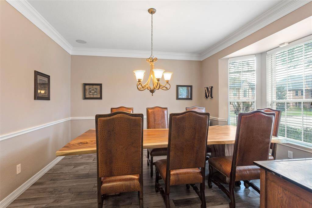 Entire downstairs has the same wood look tile flooring installed in 2019.