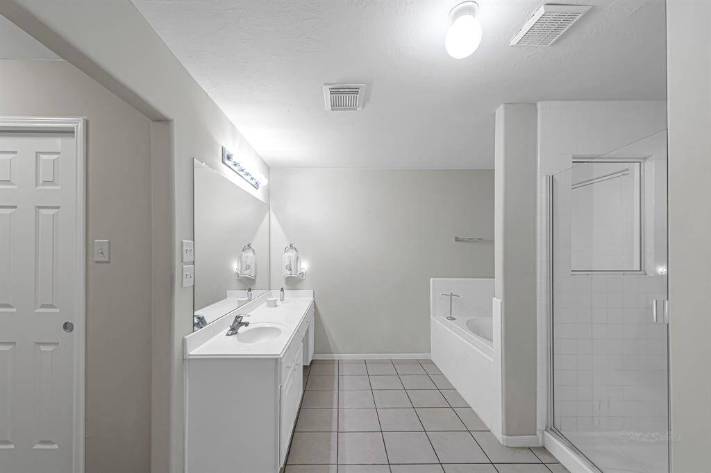 Step into your private sanctuary –the primary ensuite bathroom –where tranquility and functionalityblend seamlessly. Along one wall, along vanity stretches, providingample storage and countertop spacefor your daily essentials.