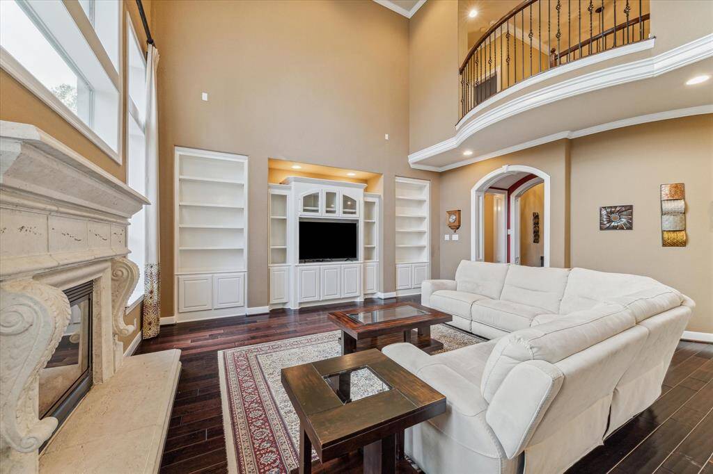 Soaring ceilings and built-in cabinetry in the living room.
