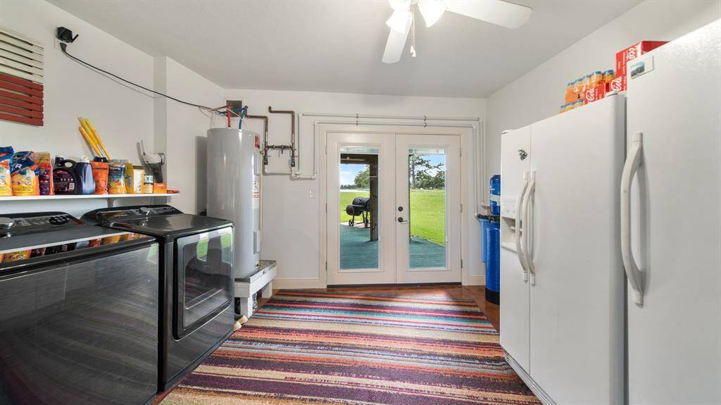 1st Floor Utility ROOM with Convenient Access to the Back Patio. Perfectly located for keeping Outdoor Dirt away from your Living Areas. As you can see, plenty of Room for Extra Fridge &Freezer.