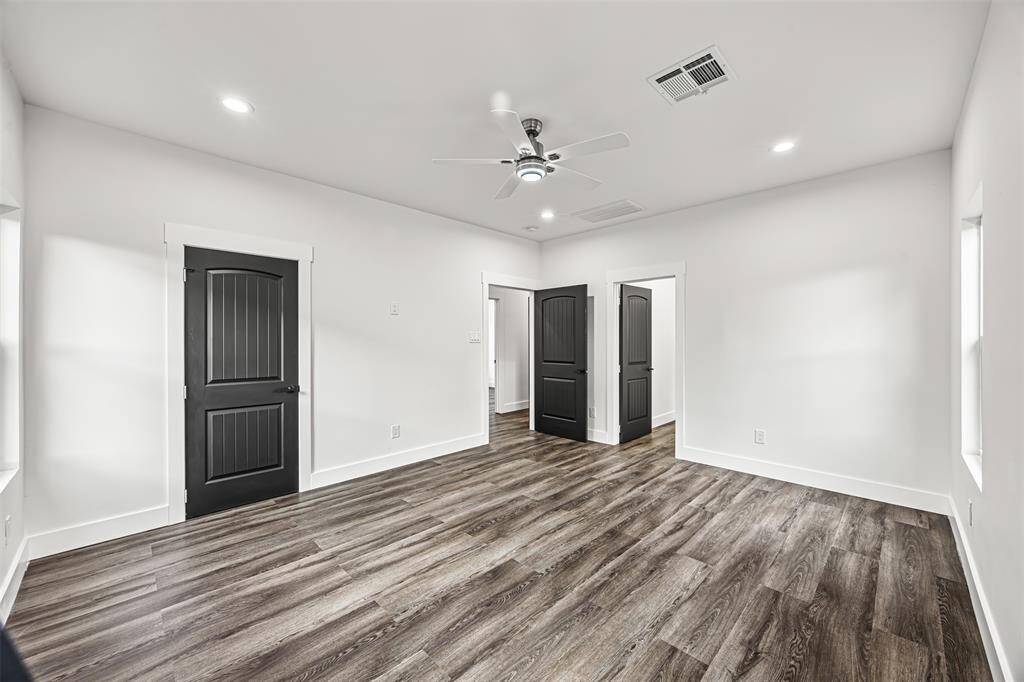 Primary Bedroom with views to primary bathroom