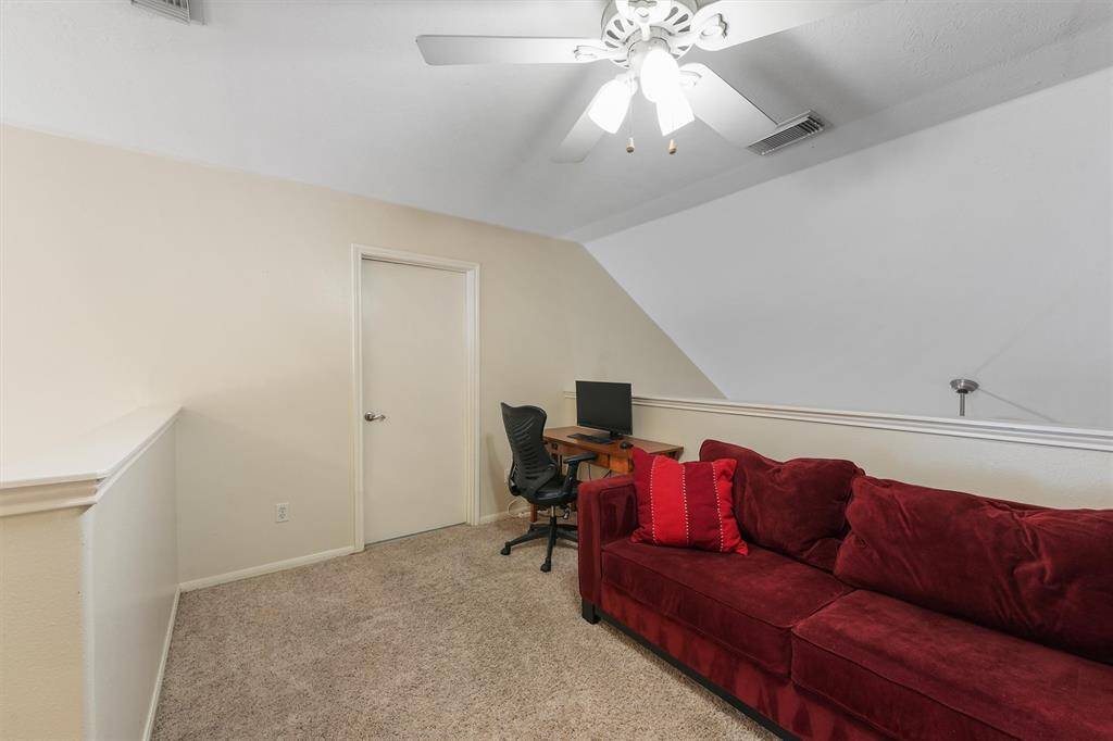 The upstairs game room with access to the attic.