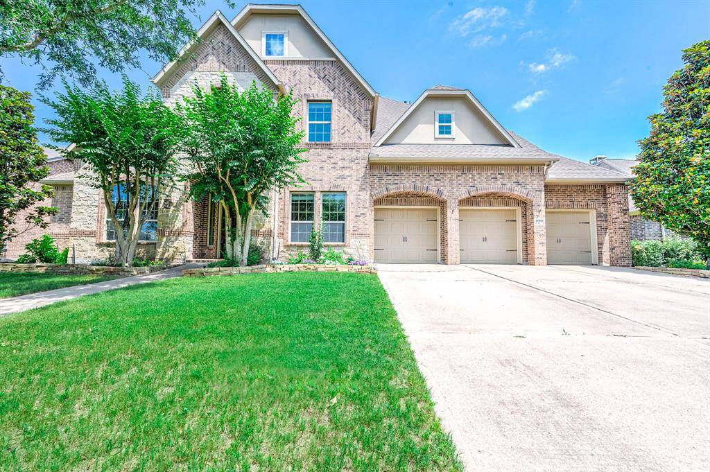 Gorgeous curb appeal! Brick and Stone exterior, expansive driveway to your 3 car garage!