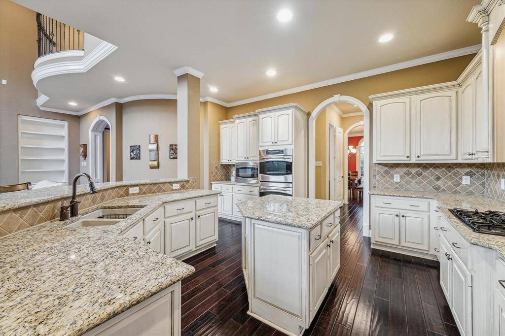 Arched doorway from the kitchen leading to the pantry and butlers' area.