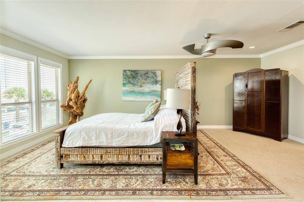 Huge primary bedroom has endless views of the Gulf. All rooms upstairs have stylish berber carpet