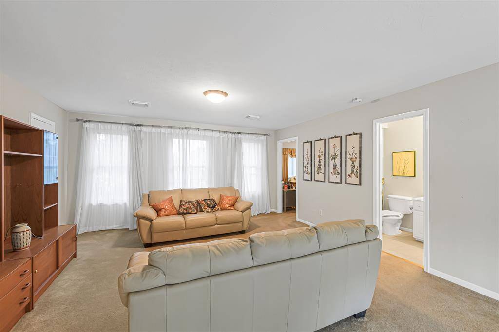 This spacious room provides a dedicated area for activities like gaming, watching movies, or playing pool, while keeping noise and clutter separate from the main living areas downstairs.