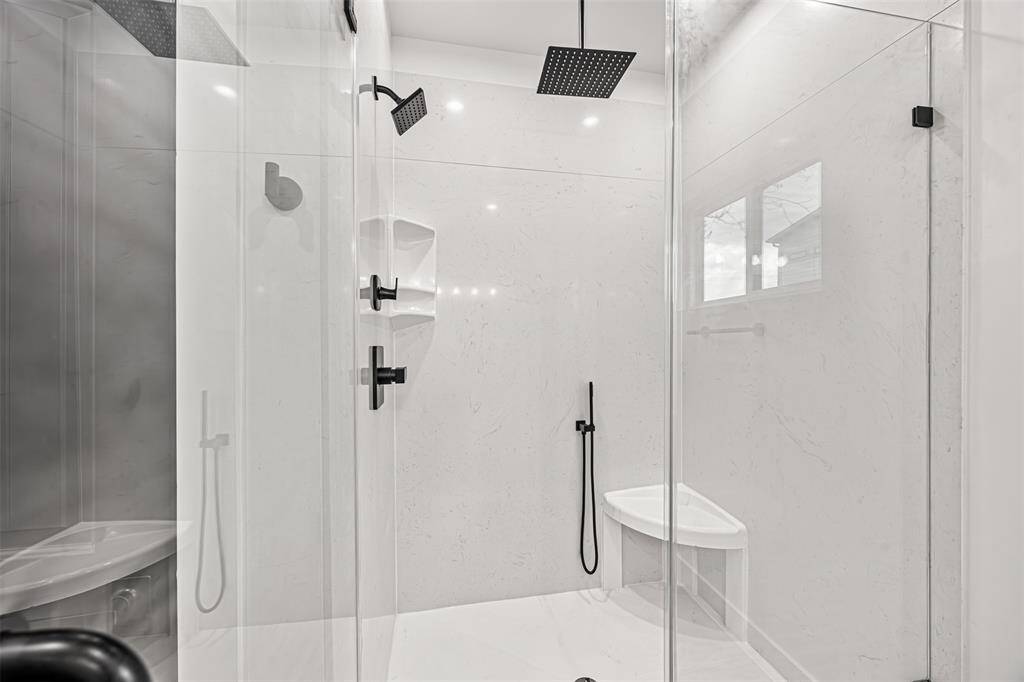 Custom shower with a seat and shelving