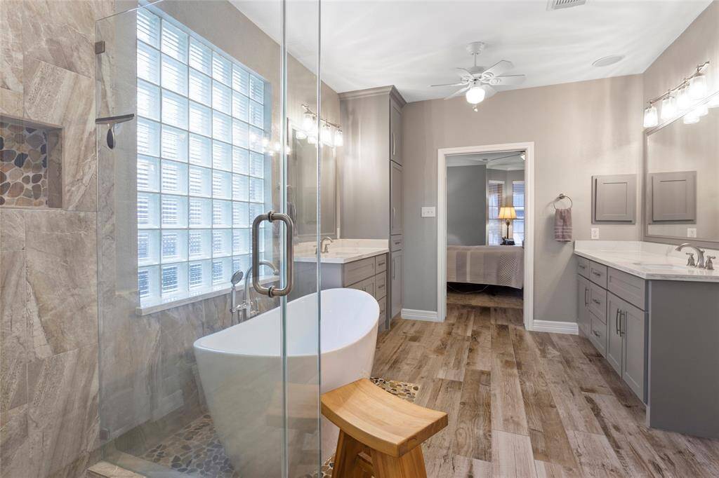 Remodel included freestanding tub and frame-less glass walk in shower.