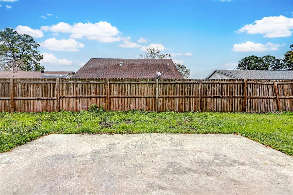 The backyard patio offers a perfect space for outdoor dining, barbecues, or simply relaxing in the fresh air. Surrounded by a privacy fence, this blank canvas awaits your personal touch to transform it into your dream outdoor oasis.