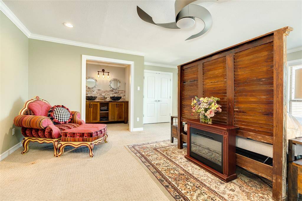 Primary bedroom has plenty of space for multiple seating areas