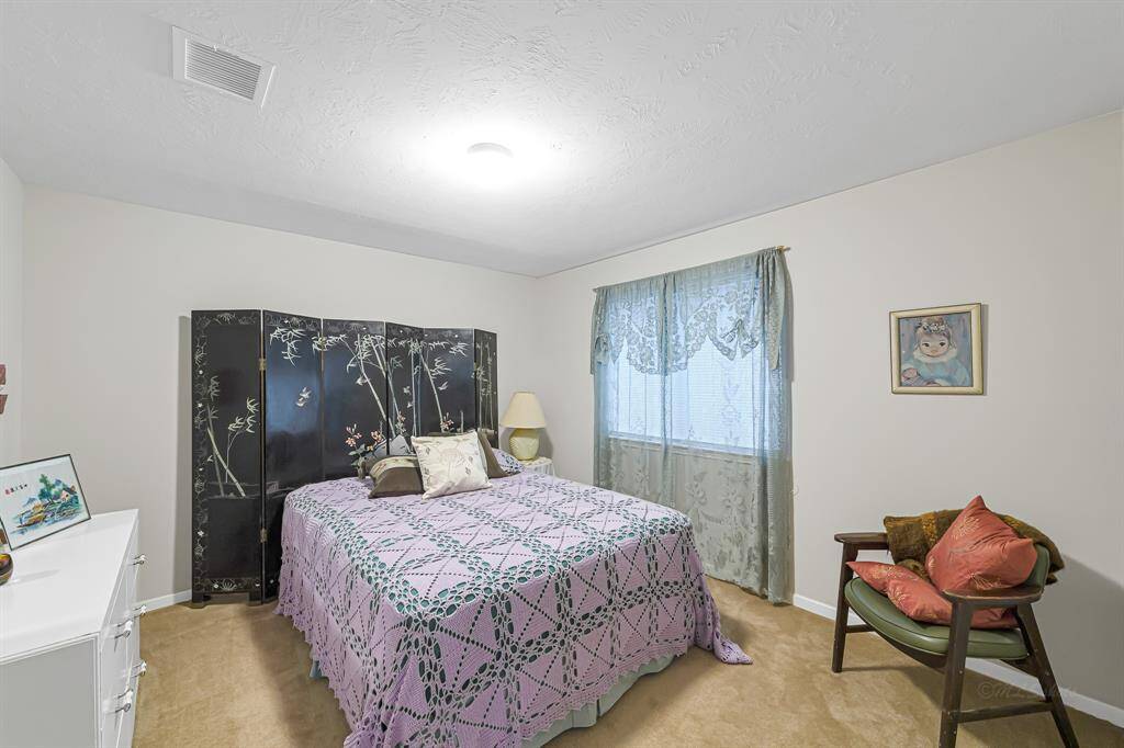 The secondary bedrooms offer plush carpet, decoratorpaint, and a closet.