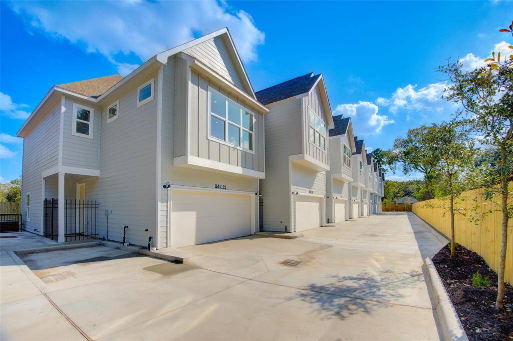 Nestled in a serene community, these modern townhomes offer stylish living with expansive windows, attached garages, and private entries. Enjoy the perfect blend of privacy and community living.