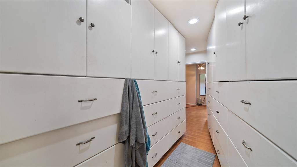 Huge Owner's Walk-In Closet with Custom Cabinetry - Additional Update included New Blown-In Insulation completed in February 2023