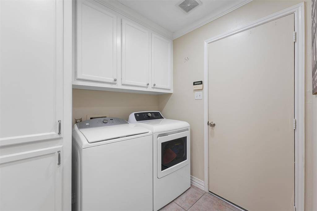 Laundry room with plenty of storage space.