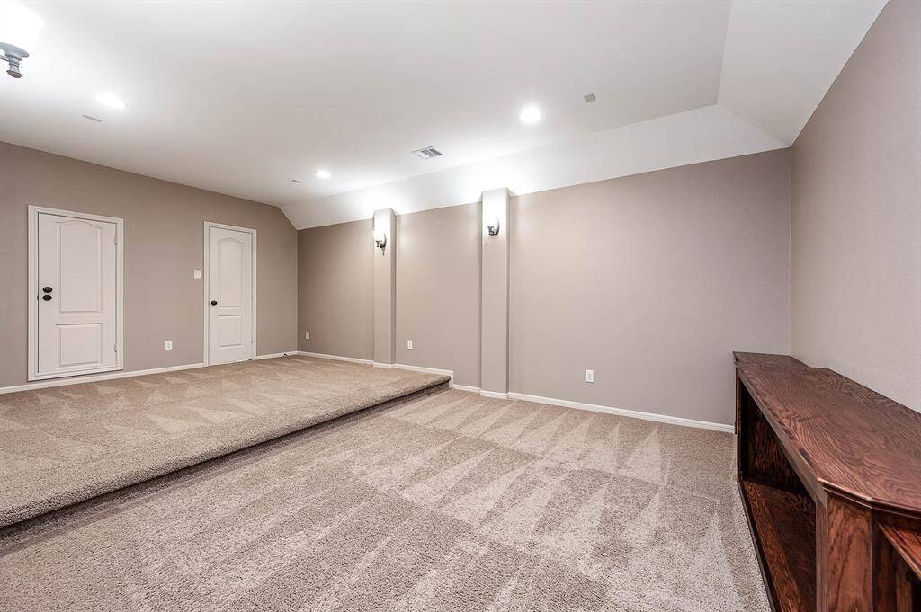 Large MEDIA Room w/Custom Built-in for media storage, games, etc. Wall Sconces, wired for surround sound and large storage closet!