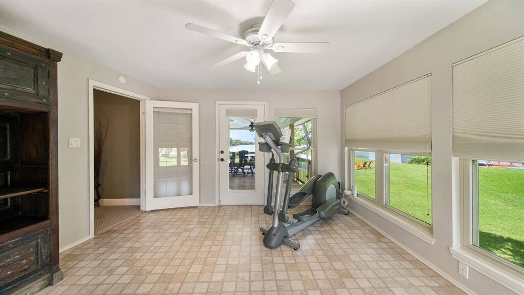 Sunroom/Flex Space has Walls of Windows and Easy Access to the 2nd Floor Covered Deck. This would make a Great Artist Studio, Hobby Room, Gym or Quiet Reading Room. How would you use this space?