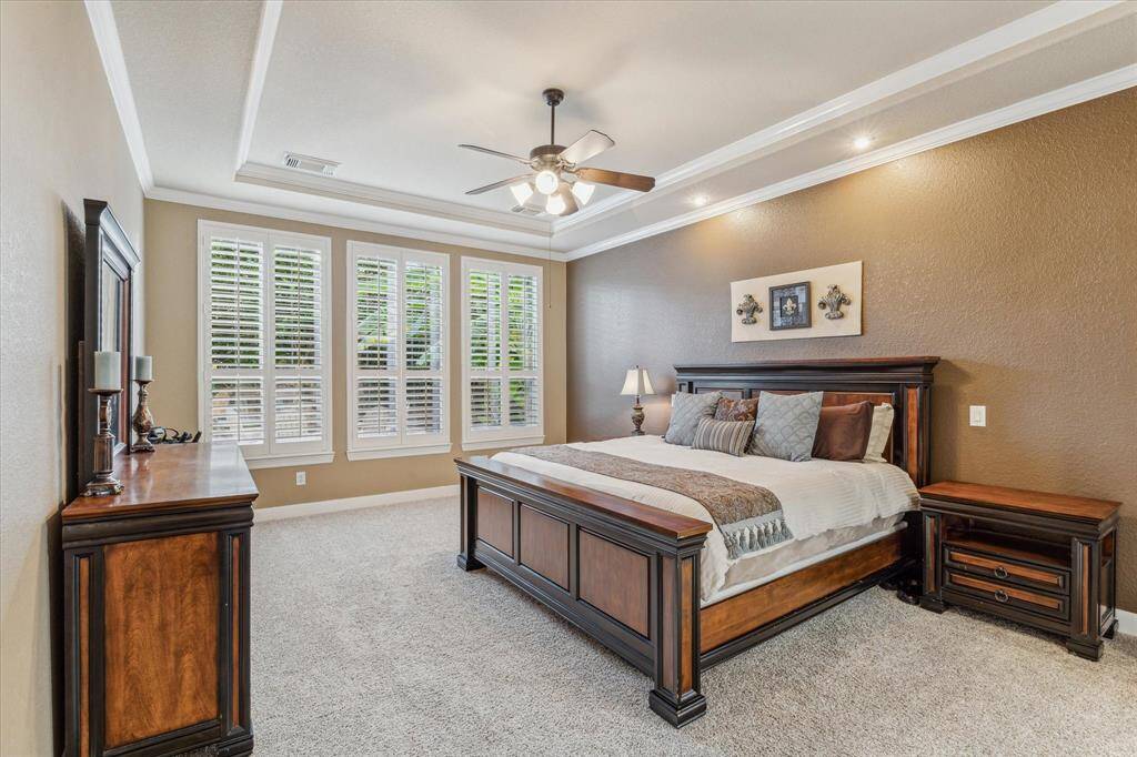 Huge primary bedroom with enough room for a sitting area.