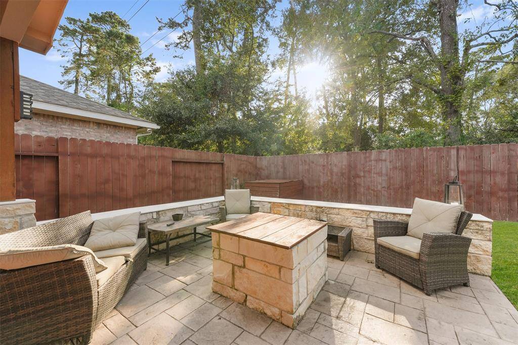 This  outdoor portion of the patio has a  built-in stone fire pit to enjoy an evening under the stars.