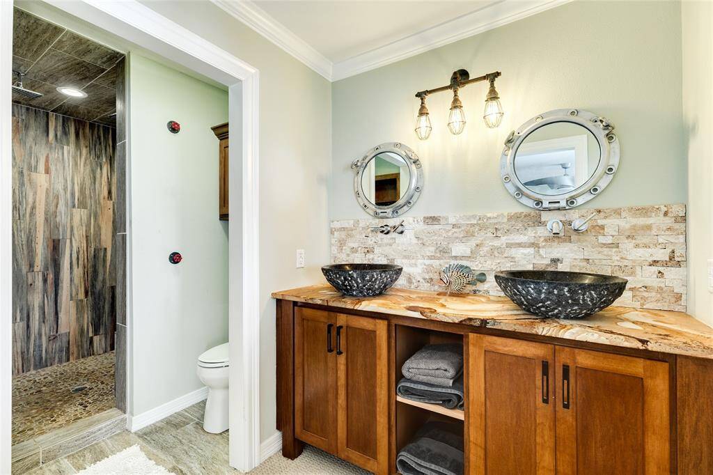 Double vessel sinks sit on a gorgeous piece of granite