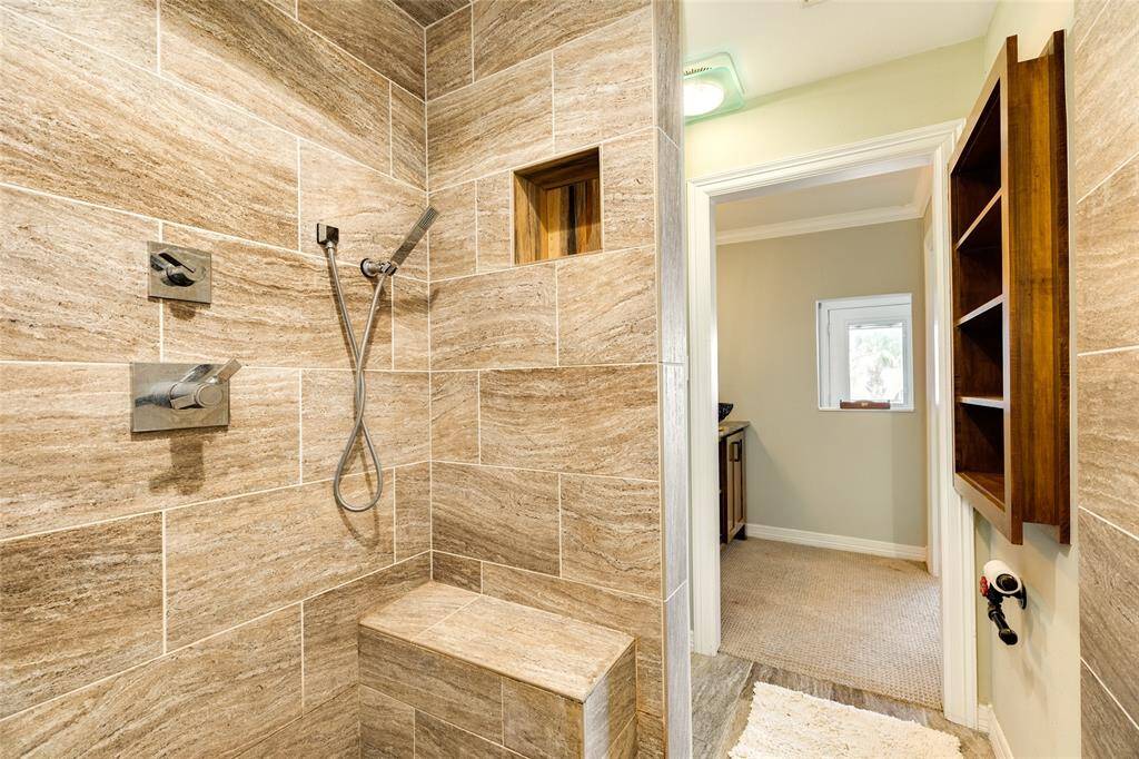 Huge walk-in shower has mulitple shower heads. Wall cut-out provides views of the Gulf!
