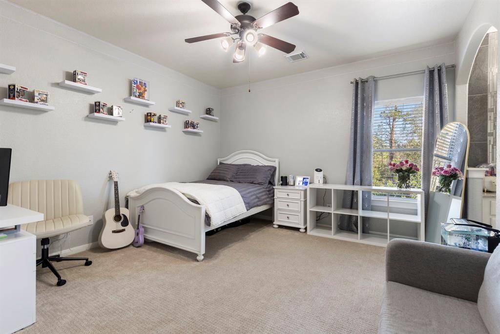The secondary bedroom is exceptionally spacious, featuring an impressive large closet, providing plenty of room for both comfort and storage.