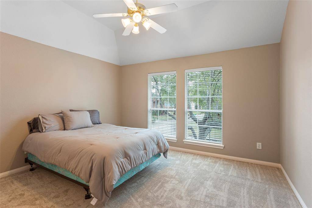 One of the 4 bedrooms upstairs, this one has its own full private bathroom.